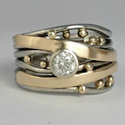 Anillo vintage con incrustaciones de circonita y oro