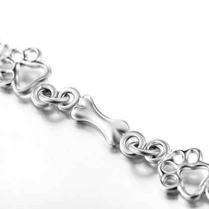 Pulsera con Colgantes de Pata de Perro y Hueso en Plata Pura