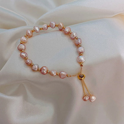 Pulsera de perlas rosas en oro