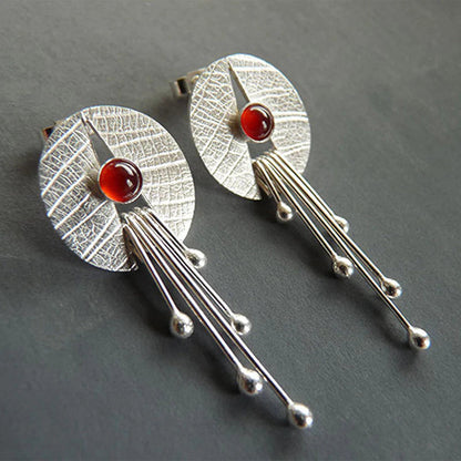 Pendientes colgantes con piedra roja hueca