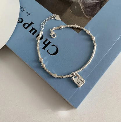 Pulsera cuadrada Amor Plateada