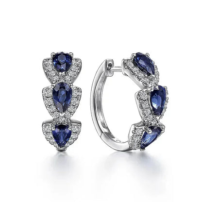 Pendientes con escudo real y piedras preciosas