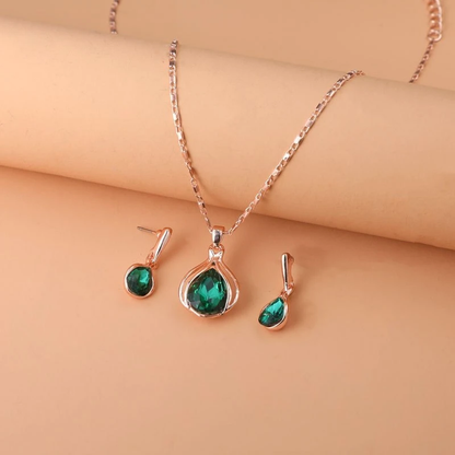 Conjunto de collar y pendientes en cristal verde y oro