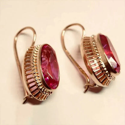 Pendientes en oro rosa con piedras rojas