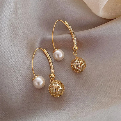 Pendientes colgantes vintage en oro y perlas